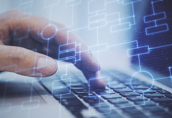 Blue network structures in the foreground, a hand typing on a keyboard in the background