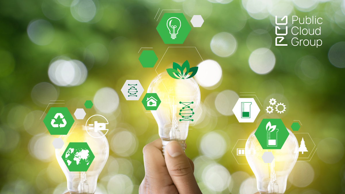 Green Lucent Background with Icons around sustainability in front of it and a hand holding a light bulb