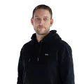 Portrait of Philipp Richter, showing him in professional attire with a neutral background.
