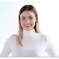 Professional portrait of Alina Schneider smiling in a white top.