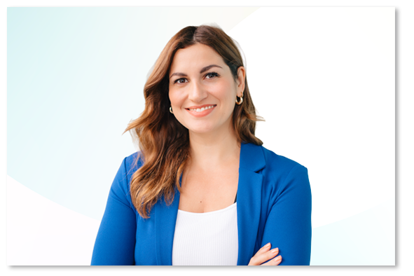 Rebecca Kennedy in a blue blazer in front of a light blue and white background